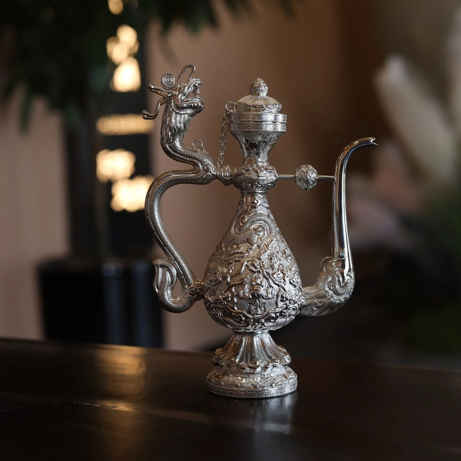Decorative ewer with a dragon-shaped handle