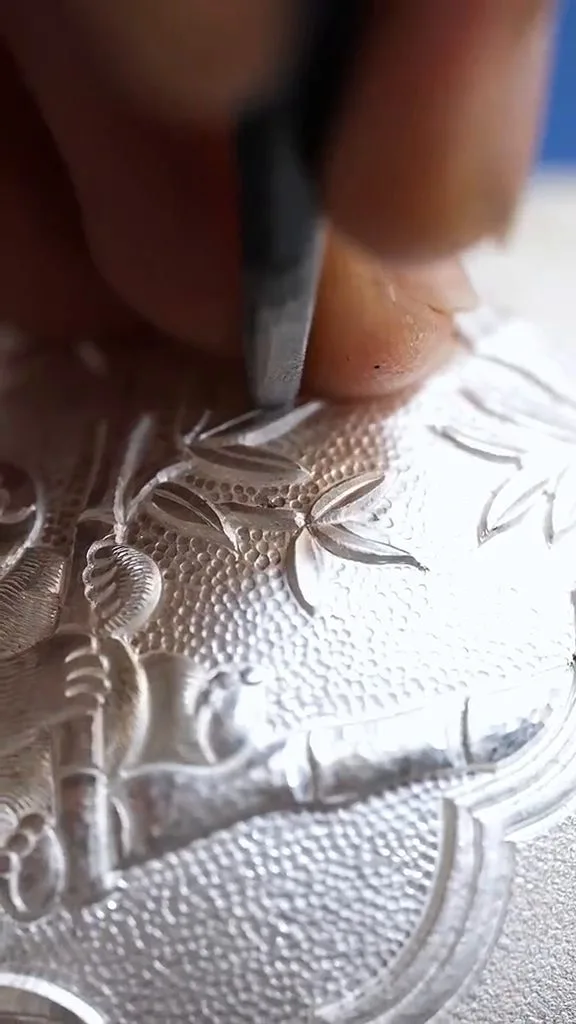Bamboo chasing detail — proper care keeps hand-chased patterns lustrous for years