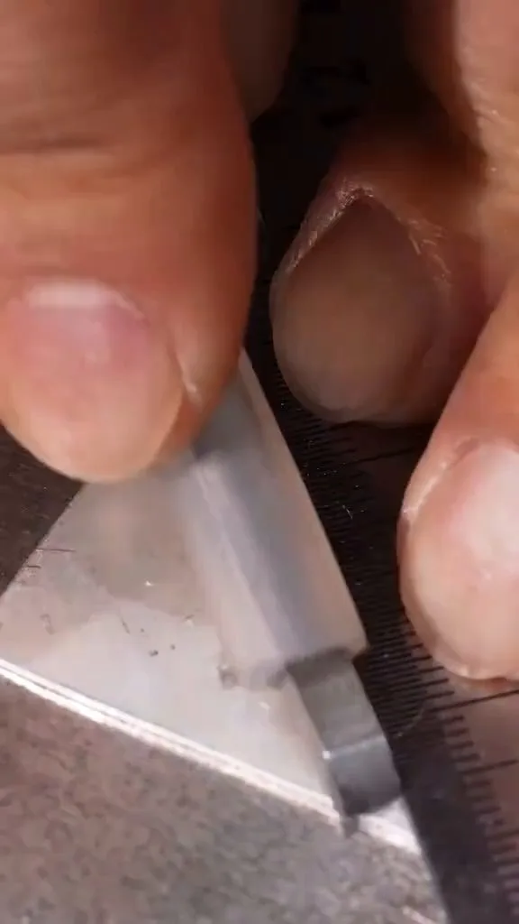 Measuring silver for cutting — every 999 piece starts from the silversmith's hands